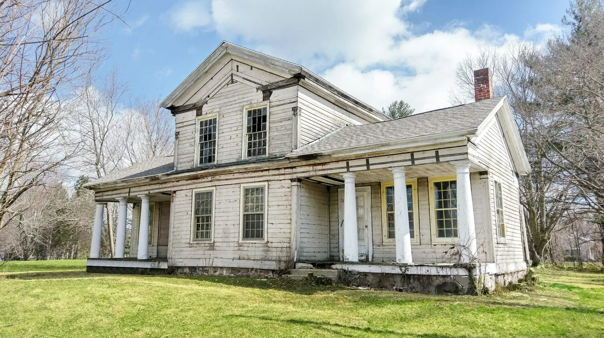 Interior details of the Wolcott House during restoration, showing original built-in cabinets and fireplace mantels