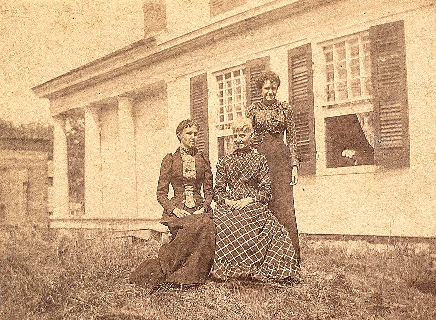 Circa 1900 photograph of Abby Wolcott outside the Wolcott House in Wolcottville, Indiana